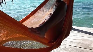 HOT BRUNETTE MASTURBATES OUTSIDE ON HAMMOCK CUMS NICE