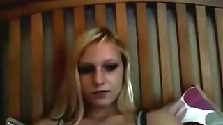 Hot blonde girl flashes her tits and plays with a toy on the floor