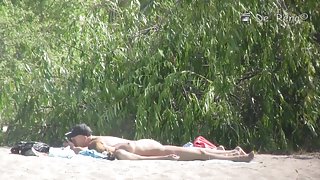 Beach nudist hunter voyeuring nude bodies from behind bushes