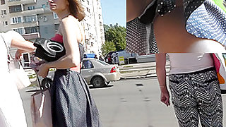 Skinny brunette on high heels in the upskirt video