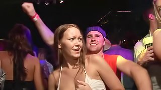 Randy models in the club partying and kissing while showing tits