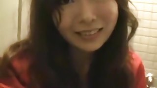 Asian girl tapes herself masturbating on a public toilet upskirt