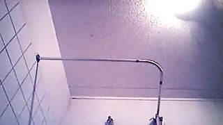She washes her body and gets dressed on shower hidden cam